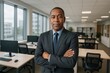 © Rony - Confident African American Businessman Professional Portrait Modern Office Setting Successful Executive Corporate Leader Strong Leadership Management Team Businessperson Executive Suit Serious