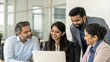 © Jo - Indian Group of Professionals Leaning in for Collaborative Discussion