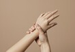 © Vooglo.com - Soft Hands Gentle Touch Beige Background Skin Care Minimalist Elegant Beauty Woman Hand arm spa pale
