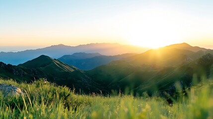 Leinwandbilder - Sunrise over rolling green mountains, a breathtaking vista of layered peaks bathed in golden sunlight, with foreground grass adding depth and texture to the scene. : Generative AI