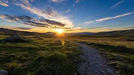 Poster - Sunset over a grassy mountain path, with sun rays bursting through clouds, illuminating the rocky terrain and distant hills. A tranquil scene of nature's beauty at golden hour. : Generative AI