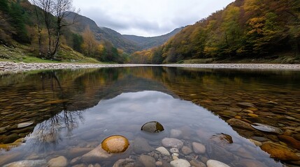 Poster - Serene autumnal river reflecting colorful foliage and mountains, clear water reveals smooth river stones. : Generative AI
