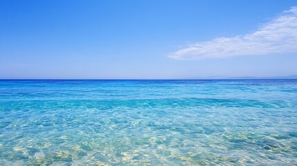 Poster - Serene turquoise ocean water under a vibrant blue sky, with a distant mountain range barely visible on the horizon.  A few fluffy clouds add subtle texture to the otherwise clear sky. : Generative AI
