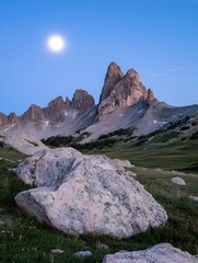 Poster - Majestic mountain peaks under a full moon, showcasing rugged rock formations and a serene alpine meadow at twilight.  The vast, clear sky enhances the dramatic landscape. : Generative AI