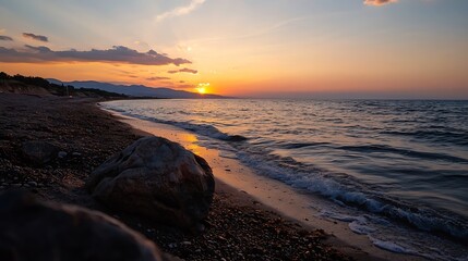 Poster - Serene sunset over a pebble beach, with gentle waves lapping the shore and a large rock in the foreground, creating a tranquil coastal scene. : Generative AI
