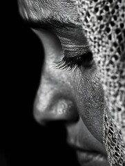 Poster - Close-up monochrome portrait of a woman's face partially veiled, showcasing detailed skin texture and long eyelashes, creating a mood of introspection and mystery. : Generative AI