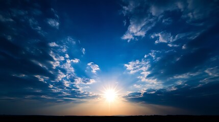 Poster - Dramatic sunset scene with bright sun rays bursting through dark blue clouds and a silhouetted horizon, creating a vibrant and colorful sky. : Generative AI