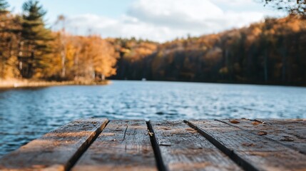 Poster - Rustic wooden dock extends over calm lake water, autumnal forest blurred in background, peaceful autumn scene. : Generative AI