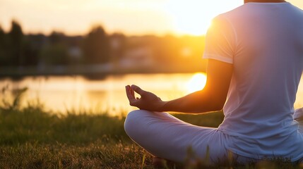 Poster - Man meditating in lotus position at sunset by a lake, serene and peaceful atmosphere, golden hour light illuminating his figure, tranquil nature scene. : Generative AI