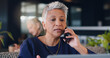 © peopleimages.com - Mature woman, business and phone call in cafe, laptop for article info with communication or journalist contact. Mobile conversation, review or feedback with lead for story or remote work research