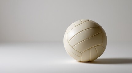 Aufkleber - A white sports ball featuring clear stitching rests against a soft white backdrop, creating a minimalist aesthetic with ample copy space on the left