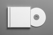 © KP Creative Stock - CD and jewel case: A minimalist product shot of a blank CD resting beside its jewel case. The composition is clean and modern. Perfect for design projects.