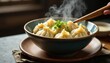 © Sourithideth - Steaming bowl of dumplings, chopsticks, soy sauce , lunch, pork