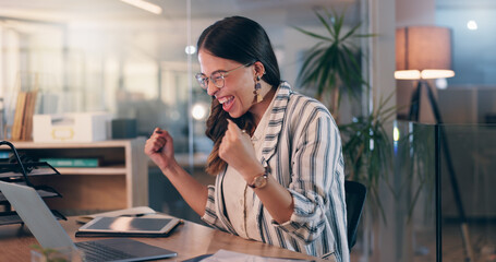 Fototapete - Woman, fist and success with laptop at office, night and celebration for goals, winning or promotion at startup. Person, writer and happy with cheers, bonus or approval for project at creative agency