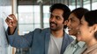 © Jo - Indian Coworkers Talking About Marketing Ideas in Modern Office Nook