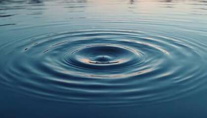 Leinwandbilder - Concentric circles ripple across water surface. Calm nature scene shows circular wave motion, reflecting light creating abstract design. Tranquility, peace, relaxation concept.