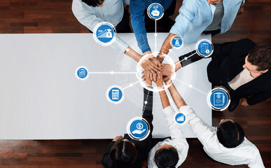 Aufkleber - A dynamic overhead view of diverse individuals united through teamwork, surrounded by digital icons representing finance, tax, and business strategy, showcasing modern collaboration. Amity
