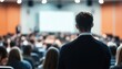 © Tetiana - Blurry Speaker At Professional Conference With Focused Audience Listening Closely: A Captivating Scene Of Engagement And Knowledge Sharing.