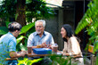 © CandyRetriever  - Asian adult couple surprised elderly father with gift box at outdoor cafe restaurant on summer holiday vacation. Family relationship, celebrating father's day and senior people health care concept.