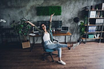female programmer rejoicing in stylish office space with coding screens and modern technology