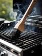 © Prime path 515 - Close-up of a barbecue grill being cleaned with a wire brush while smoke rises, emphasizing cleanliness and maintenance of outdoor cooking equipment