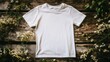 © budi - Blank White T-Shirt Mockup on Rustic Wooden Surface with Floral Accents