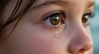 © TAIFUR - Close up of eye tear sad child girl crying eyes tearful face emotional expression sadness sorrow grief pain