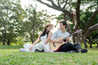© Pavitra - Asian young couple spend time on romantic date in the outdoors garden.