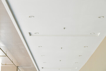Poster - White ceiling with recessed lighting, modern interior, minimalistic style, clean lines, soft shadow, bright atmosphere