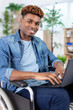 © auremar - businessman in wheelchair looking at laptop