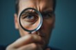 © EKA - Intense Gaze Through Magnifying Glass, Close-Up Portrait of Focused Investigation