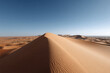 © Nemanja - vast desert dune field in niger illuminated by clear blue light showcasing intricate geometric patterns in sand