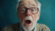 © EUT - Surprised senior man with glasses stares wide-eyed at the camera, mouth agape. Use it to show shock, humor, or illustrate unexpected news in advertising.