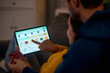 © Golf_MHNK - Romantic Couple's Online Shopping Adventure. Joyful couple shopping online, embracing technology and love at home.