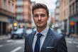 © Michael - Confident Young CEO in Business Suit Walking on City Street