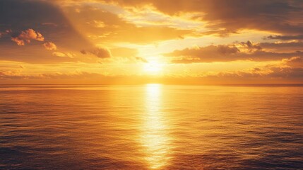 Wall Mural - a warm golden light sunset reflecting over a calm ocean, creating a serene atmosphere