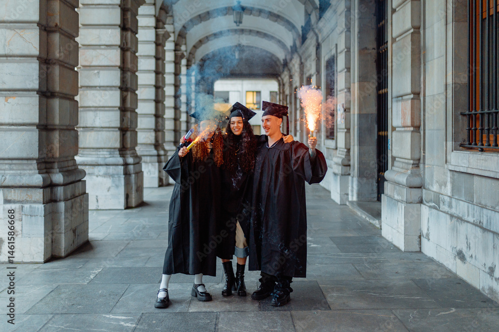 Smoking Grad Student Three cheerful multiracial students celebrating their graduation day ...