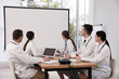 © New Africa - Team of doctors using video projector during conference indoors