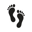 © Jahura - Simple black footprint icon. Two black human footprints vector icon