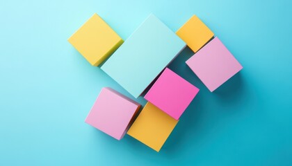 Leinwandbilder - Pastel Colored Cubes Arranged on a Light Blue Background Minimalist Geometric Composition in Pastel Hues Showing Soft Light and Clean Presentation in Top View