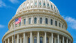 © kosoff - close-up of the Capitol Dome in Washington, D.C. and the American flag in the wind.