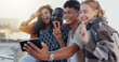 © WesleyStudy/peopleimages.com - Friends, group and selfie with peace sign at beach for social media post, travel adventure and profile picture update. Happy, people and photography on weekend trip with bonding, support and memory