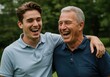 © Aklima - A father and son laughing together with arm around each other outdoors happy time