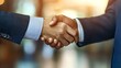 © masaidee - Meeting success. Two business persons shaking hands standing outside