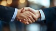 © masaidee - Meeting success. Two business persons shaking hands standing outside