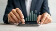 © Kage Dojo - A businessman interacts with a digital bar graph and percentage symbol rising from a smartphone, symbolizing growth and data analysis.