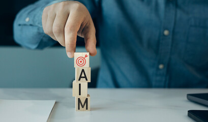 Aufkleber - Aim strategy startup business.Business Planning and goals objectives for business investment.Close-up hands showing aim icons on wooden cube.Business plan strategy and development.