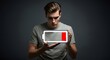 © Tadeu - Low power concept man holding glowing battery icon energy depletion and fatigue feeling drained lifestyle