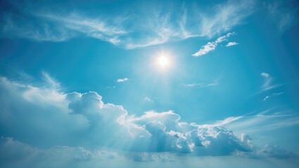 Wall Mural - sunlight piercing the white clouds against a vibrant blue sky background.