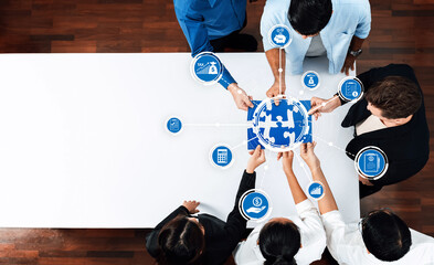 Aufkleber - This image captures a diverse group of professionals collaborating on business strategies, surrounded by digital icons that symbolize finance, analytics, and innovation. Amity